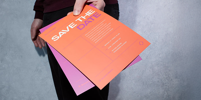 Person holding Flyers.