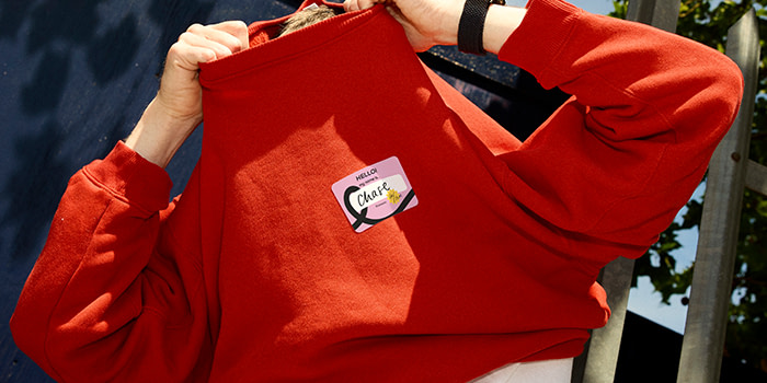 Sticker name tag on a Red jumper