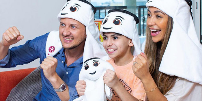 A family wearing FIFA World Cup Merch.