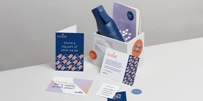 A selection of print and branded merchandise materials showing consistent branding and design