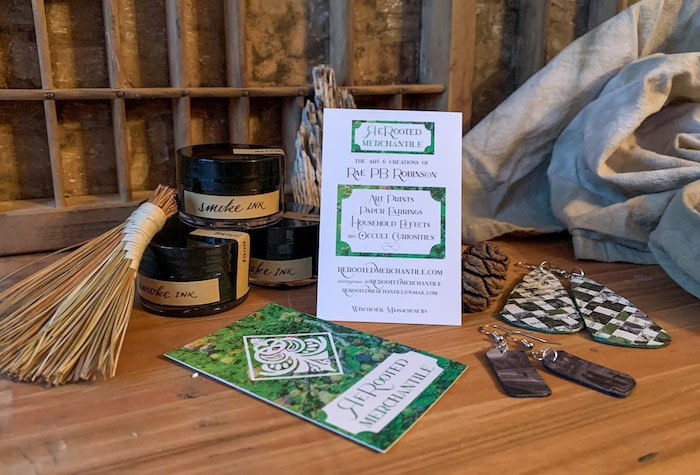 Green business cards front and back for curiosity cabinet shop Rerooted merchantile