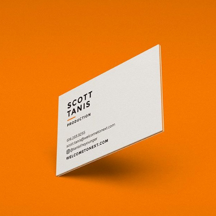Minimalist business card design against an orange background
