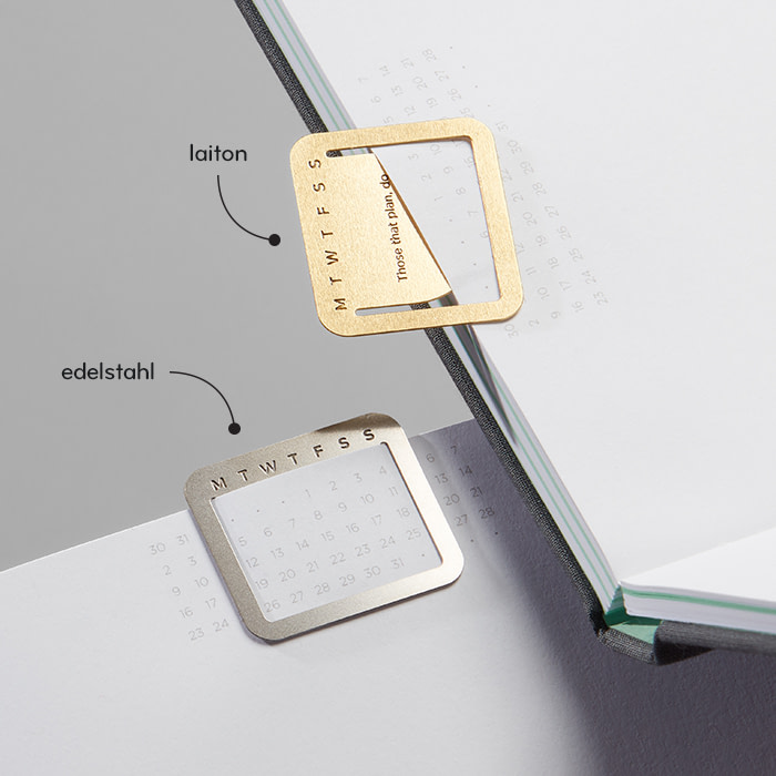 Silver and Gold Clips on business planner.