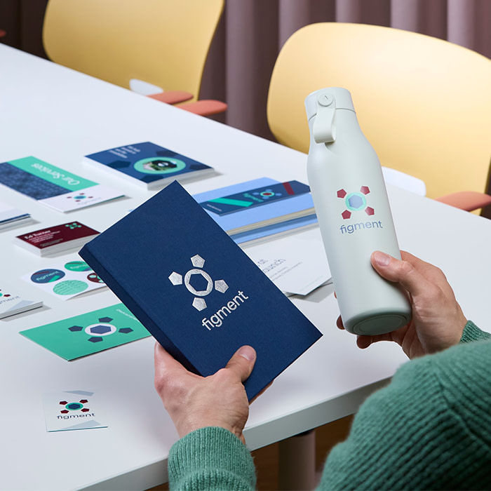 Branded Water bottle and Notebook.