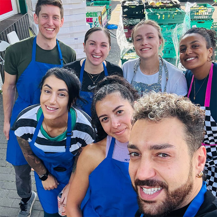 Sales team volunteering in soup kitchen.