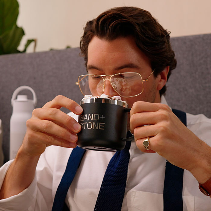 Person sipping on Mug.