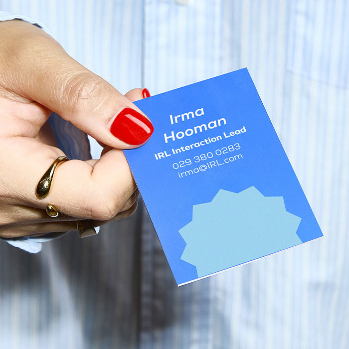 Person handing out a Business Card.