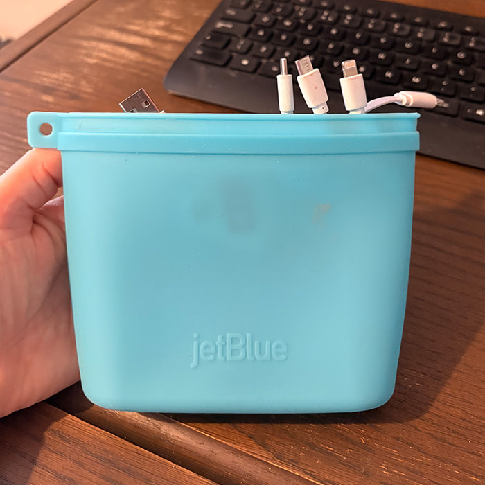 Blue silicone reusable clip-up bag from JetBlue.