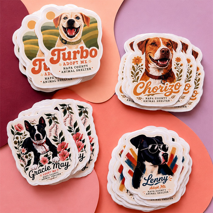 A collection of four different Die-Cut Stickers, each with an illustration of a different dog.