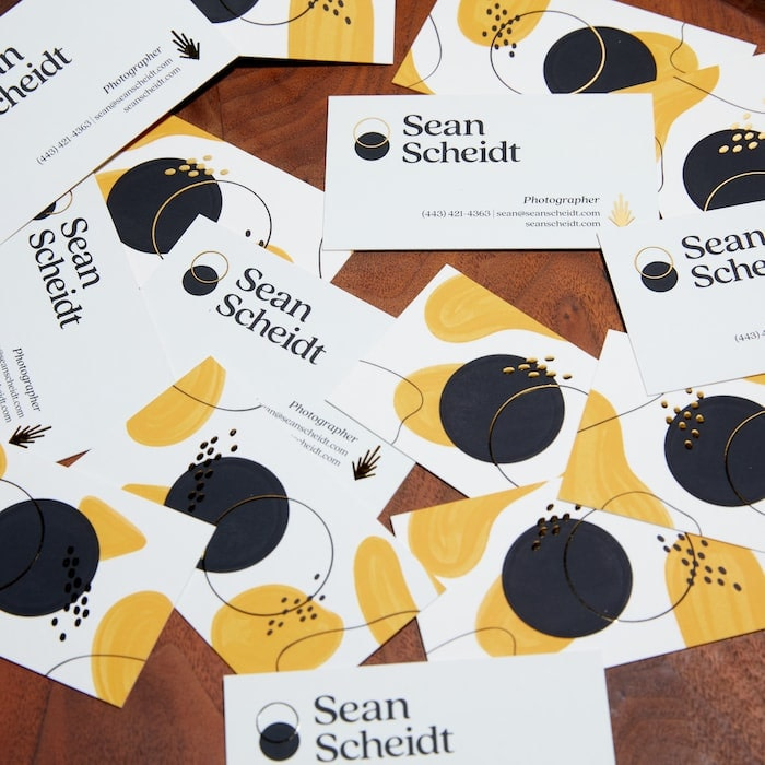 Gold foil business cards with yellow and black abstract shapes by Sophie Nolan for photographer Sean Scheidt
