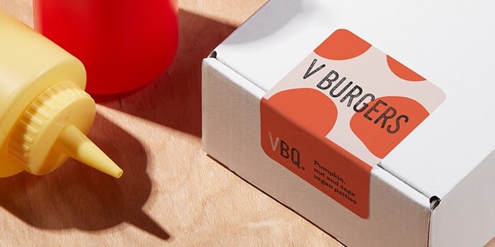 Big orange label by vegan barbecue brand on packaging