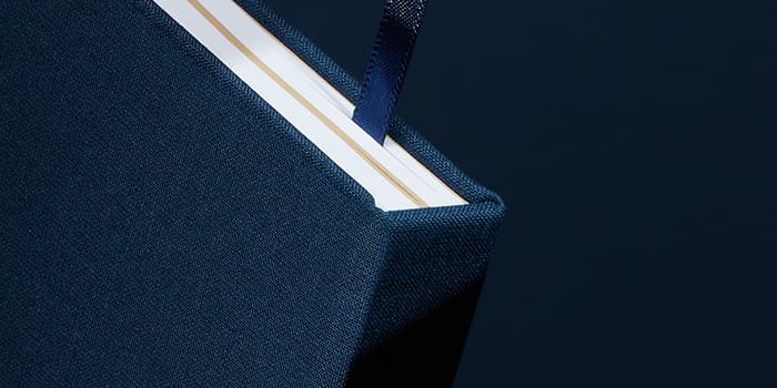 Dark blue hardcover notebook with ribbon