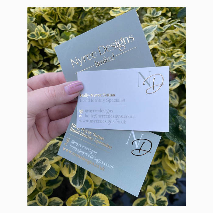 Three sage green business cards with gold foil finish front and back by Nyree Designs