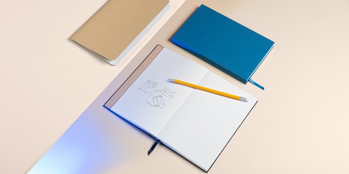 Open blue notebook with cloth cover