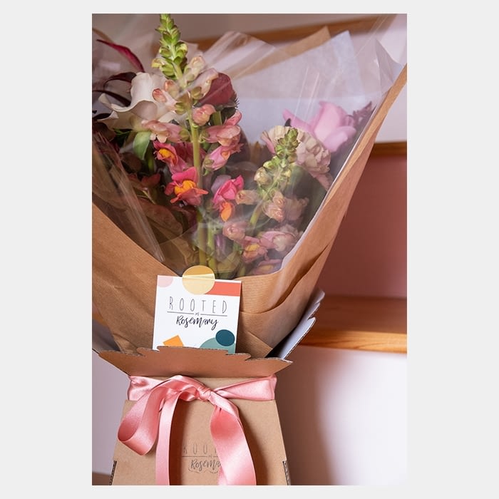 Flower bouquet with branded card by Rooted in Rosemary floral design studio in Oxford