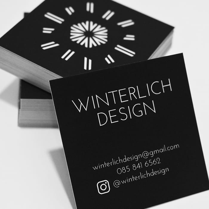 Pile of Winterlich Design square business cards