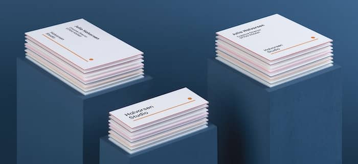Piles of extra thick business cards in various sizes and formats with colorful seams