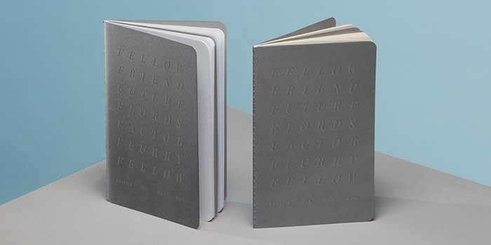 Fellow Inc agency grey softcover notebooks with debossed design by MOO