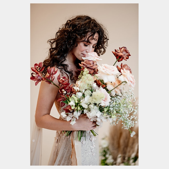 Bride with a wedding bouquet by Rooted in Rosemary floral design studio in Oxford