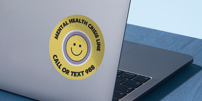 Round sticker with a smiley face promotiong the new 988 suicide prevention lifeline