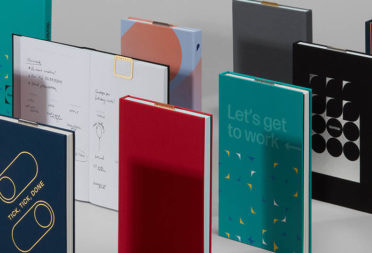 Custom Planners by MOO with various colorful planner covers