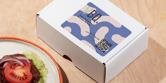 QR code sticker for a vegan barbecue brand on a package