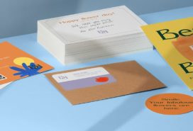 Orange and yellow flyers, postcards and round sticker next to a pile of white postcards and a brown craft envelope by fictional brand Best Buds