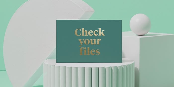 Green postcard with gold foil text saying check your files