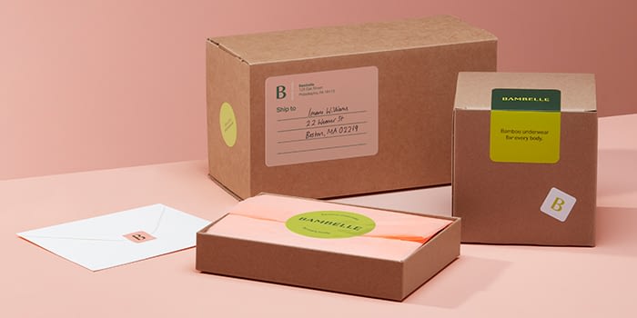 Boxes with address labels and round logo stickers