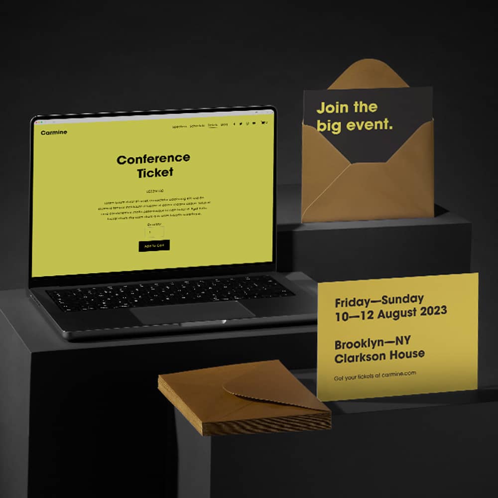 A laptop showing a website designed with Squarespace is next to matching invitations in a gold envelope.