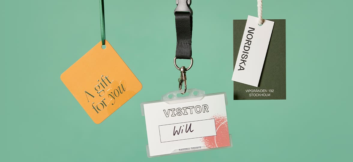 Business Cards of different shapes and sizes shown as unusual use cases like loyalty cards, clothing tags, and a guest pass.