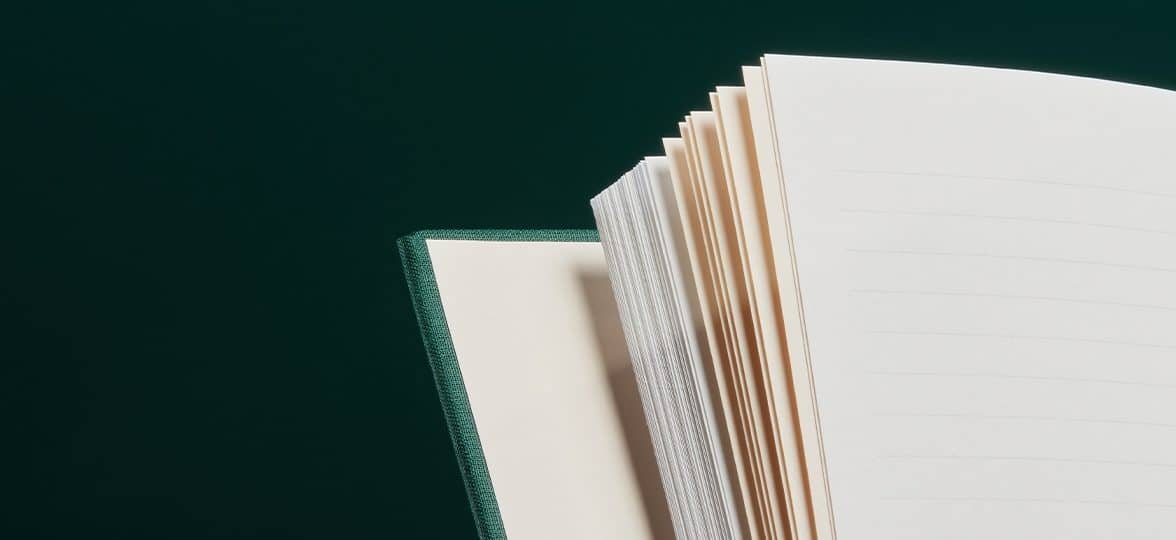 Alpine Green notebook open to a peach colored central page