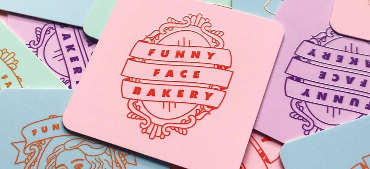 Funny Face Bakery square business cards in various colors and designs including blue Botticelli cards, green Mona Lisa cards, pink Frida Kahlo cards and purple Girl with a pearl earring card as well as mirror illustrations by Lucy Jenn
