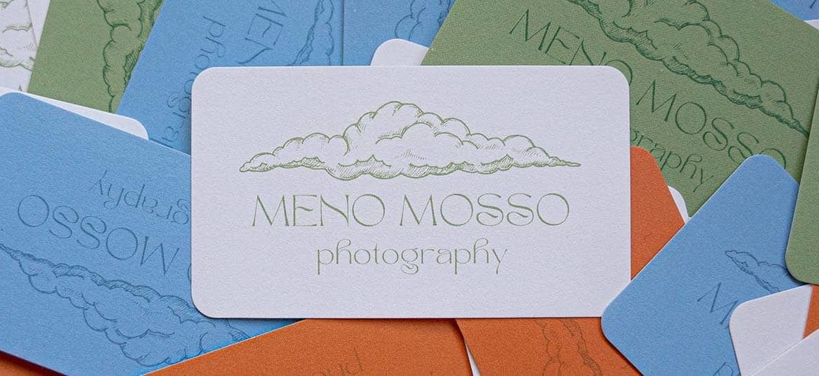 Blue, white, khaki and brick colored photographer business cards with a cloud illustration by photographer Emma Ogilvie from Meno Mosso