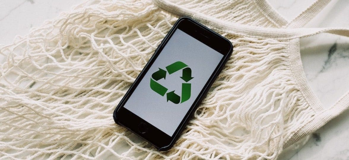 White net bag and phone with the recycling symbol