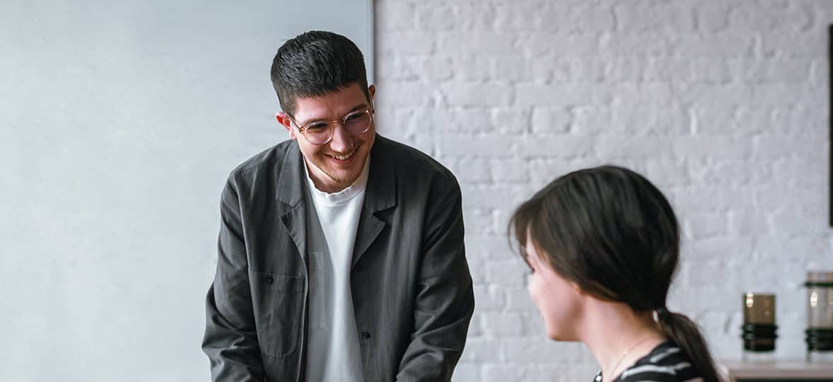 Two people talking in the office