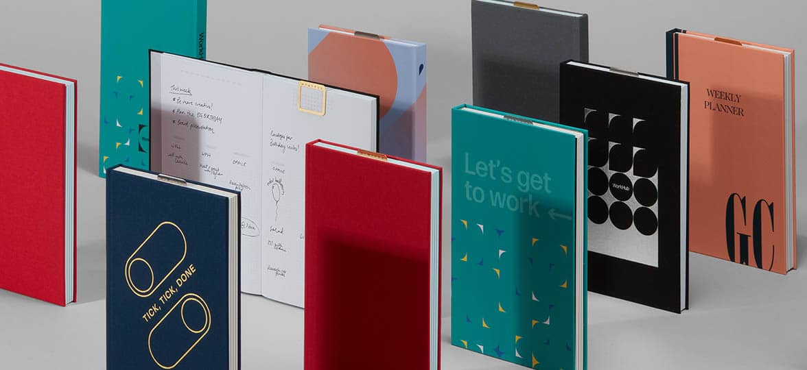 Custom Planners by MOO with various colorful planner covers