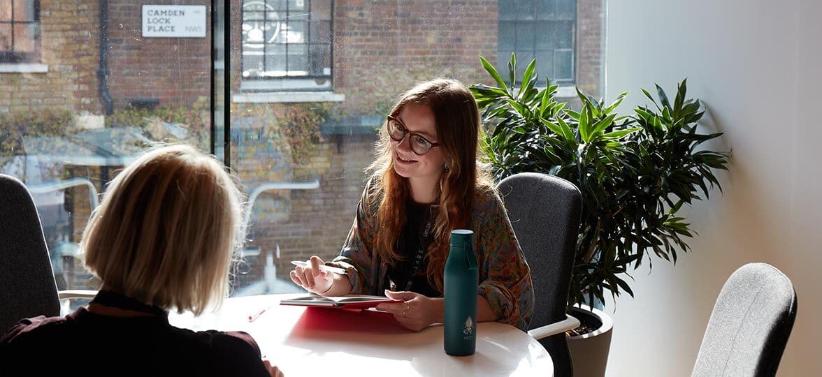 Ebba and Laëti having a meeting in a meeting room in the MOO office