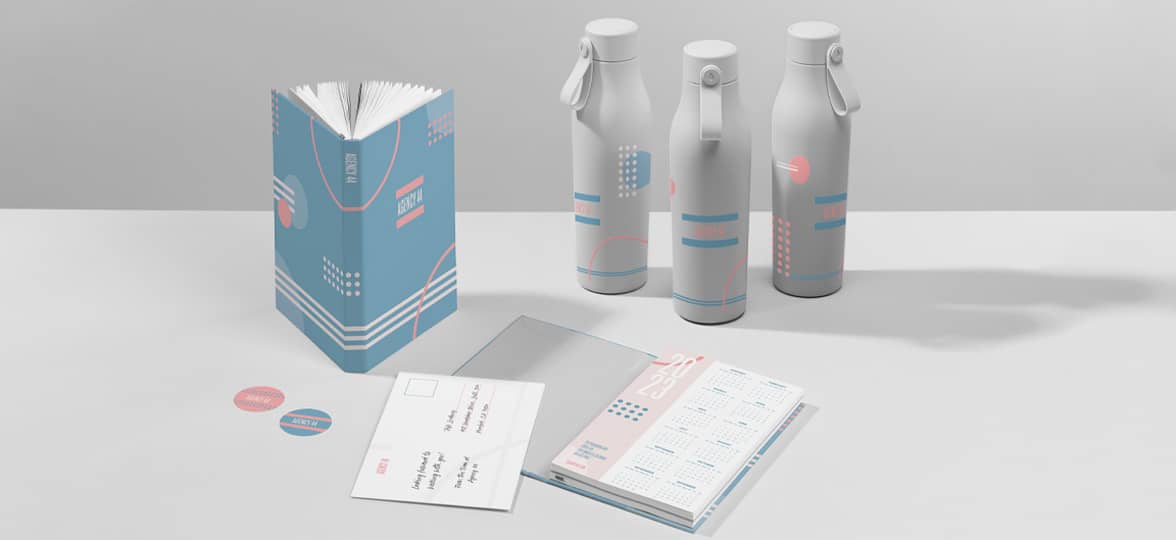 A full suite of consistently branded brand assets, including a notebook, water bottles, flyers, and stickers.