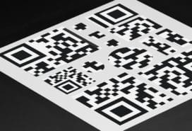 Stickers of different shapes and sizes forming a big QR code
