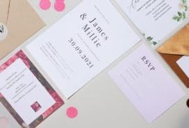 Mosaic of wedding stationery including wedding invitations, envelopes and stickers