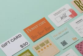A variety of business card designs laid out next to each other