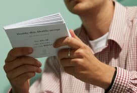 Paper Flyers being held by a business owner