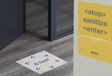Yellow social distancing poster and six feet distancing floor decal for the office