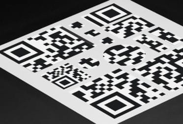 Stickers of different shapes and sizes forming a big QR code