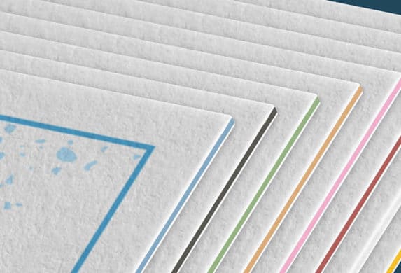 Close-up of Luxe extra thick postcards with eight different color seams