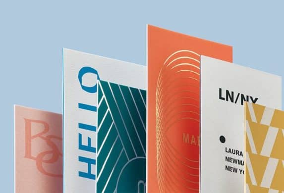 Six business cards standing in the shape of a bar chart