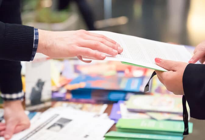 Trade show marketing in action, an interaction between exhibitor and delegate