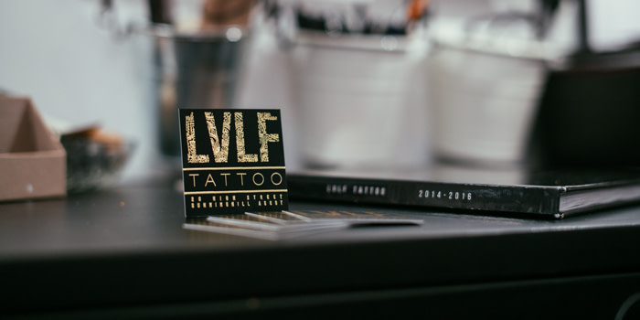 LVLF gold and black business card