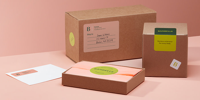 Boxes with address labels and round logo stickers
